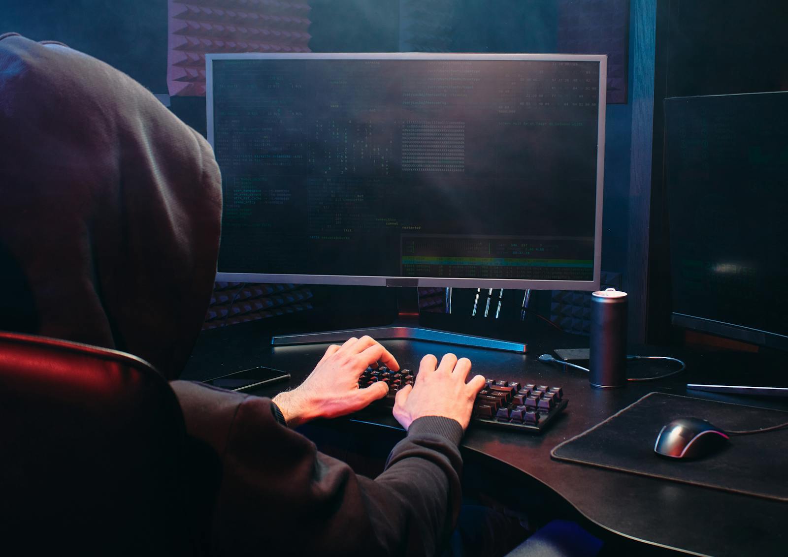 Person in Black Hoodie Using a Computer